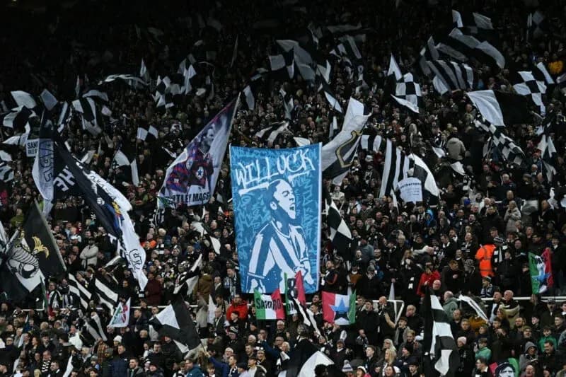 Crowd waving flags at football match Crowd waving flags at football match