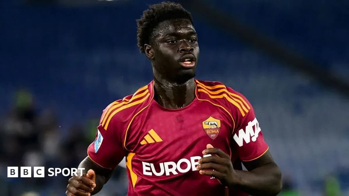 Player in AS Roma kit running on the pitch Player in AS Roma kit running on the pitch