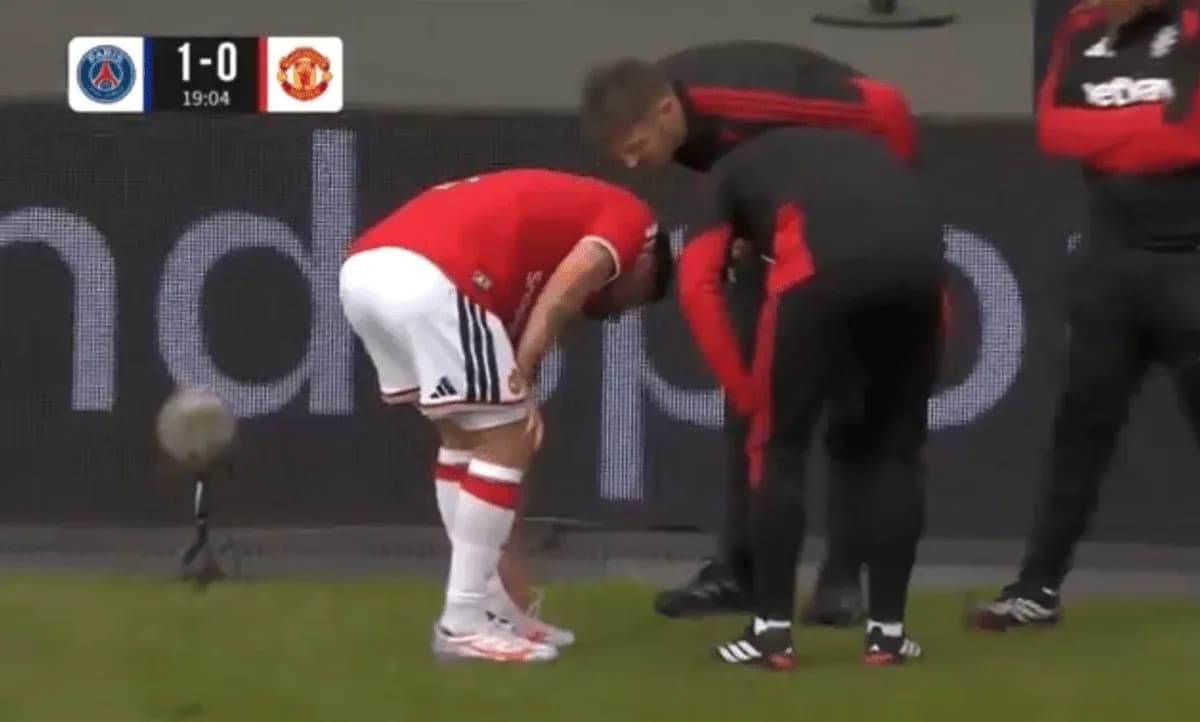 Player receiving medical attention on the sidelines Player receiving medical attention on the sidelines