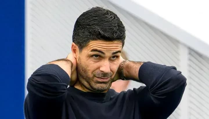 Manager adjusting his hair during training session Manager adjusting his hair during training session