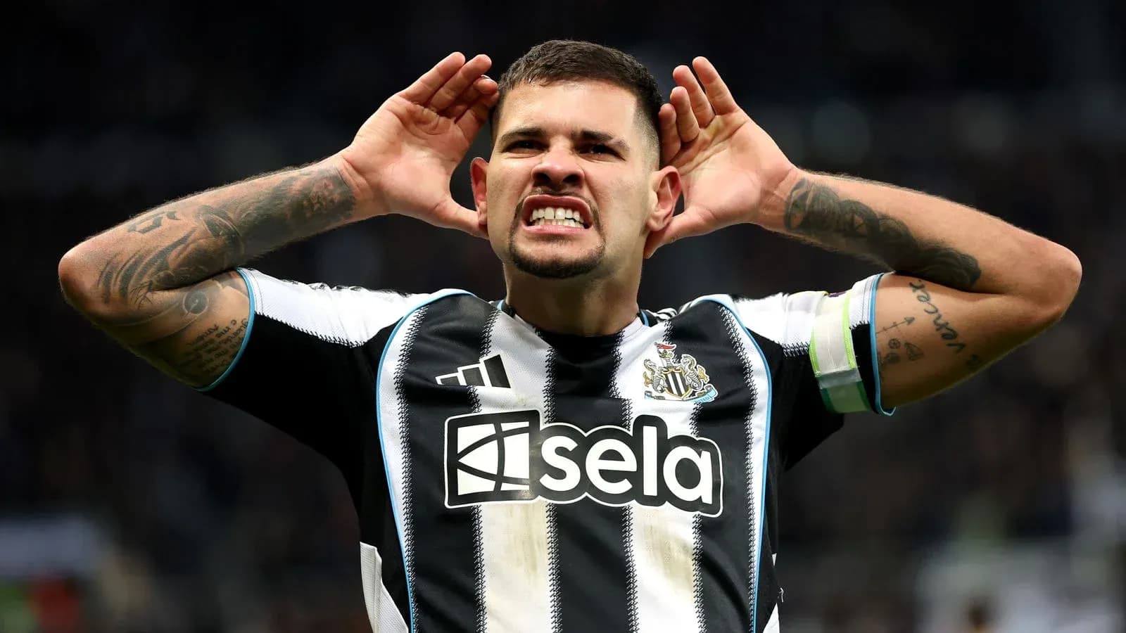 Player celebrating with hands on ears after scoring Player celebrating with hands on ears after scoring