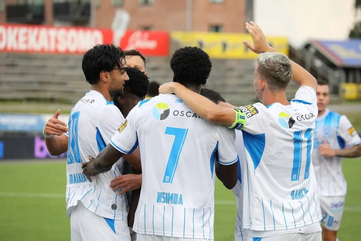 Players celebrating a goal during match Players celebrating a goal during match