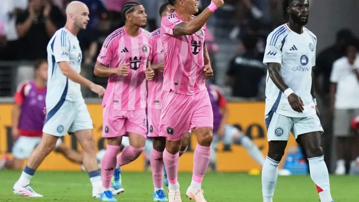 Players celebrating a goal during a match Players celebrating a goal during a match