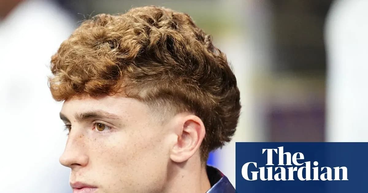Young man with curly hairstyle looking to the side Young man with curly hairstyle looking to the side