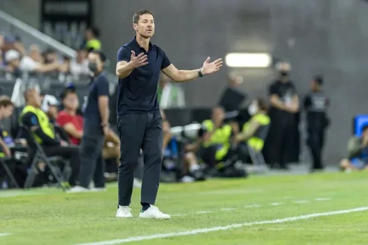 Coach gesturing on the sidelines during match Coach gesturing on the sidelines during match