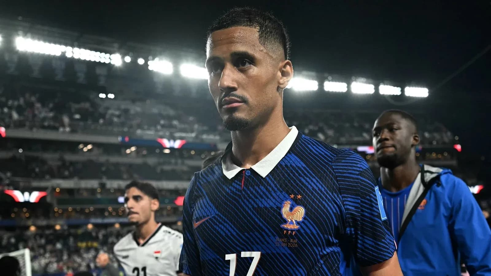Player in blue jersey walking off the pitch Player in blue jersey walking off the pitch