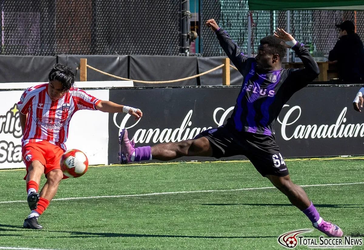 Player from Atlético Ottawa kicking the ball Player from Atlético Ottawa kicking the ball