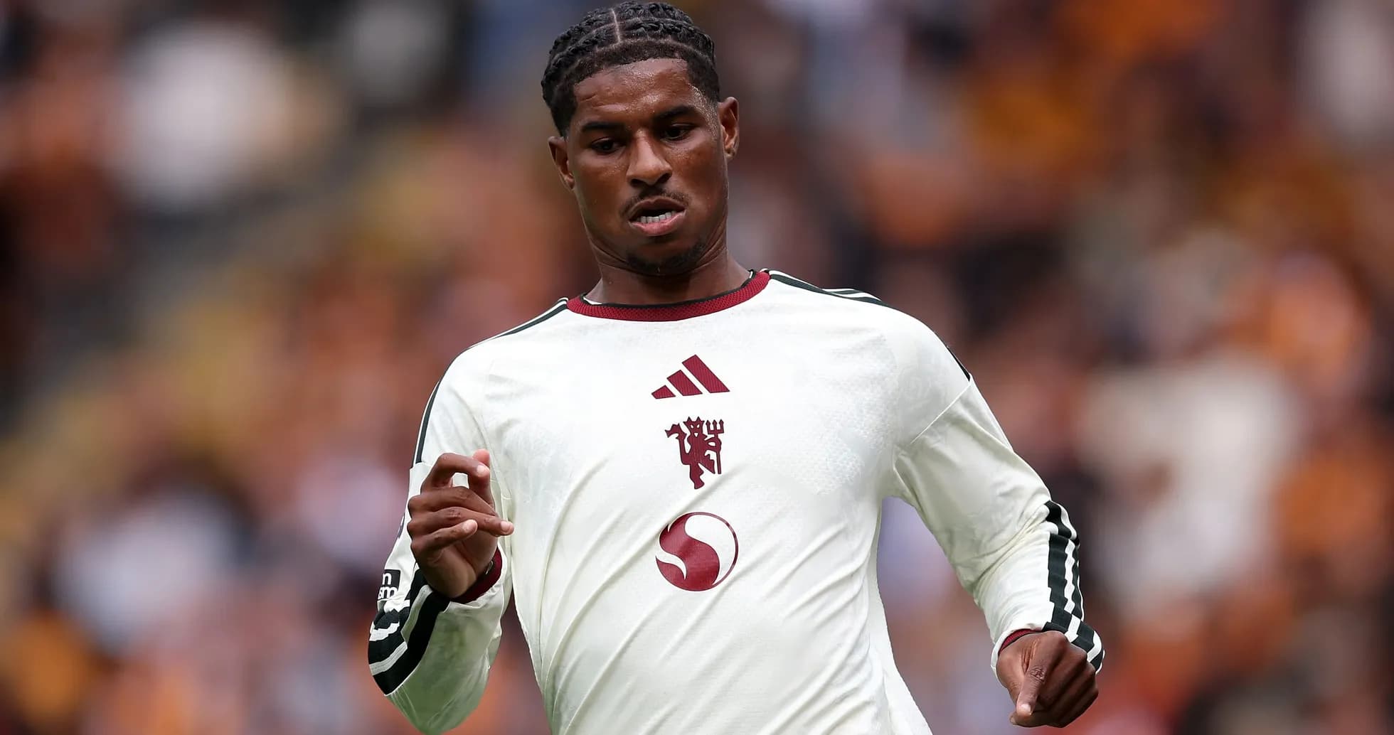 Player running in white team jersey during match Player running in white team jersey during match