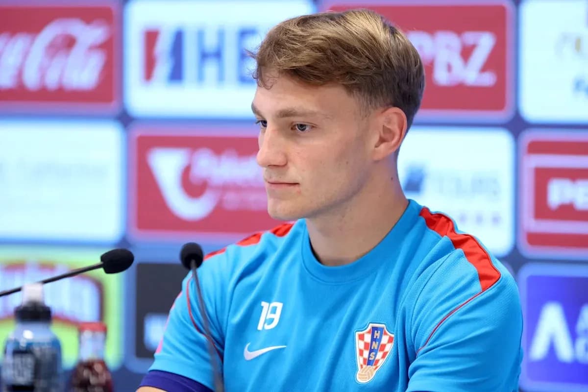 Player at press conference wearing Croatia training jersey Player at press conference wearing Croatia training jersey