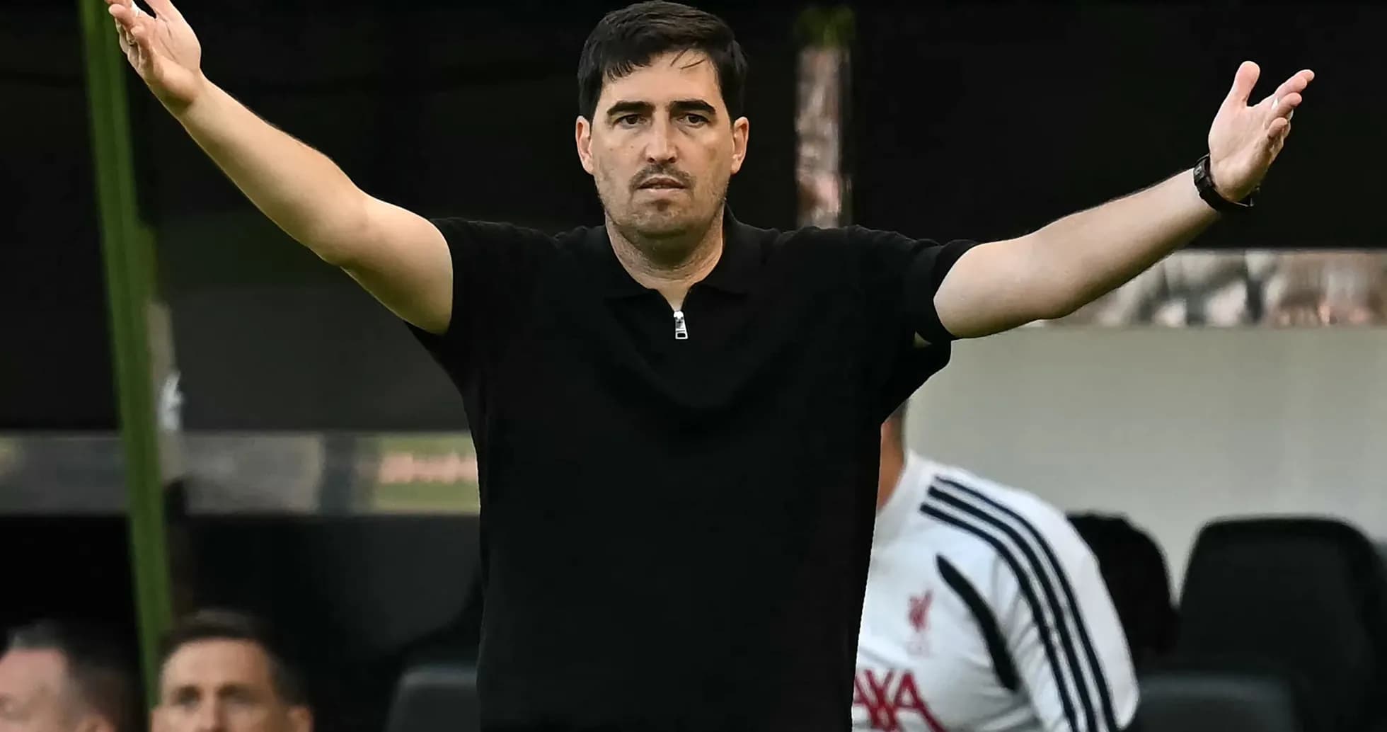 Coach gesturing from the sideline during match Coach gesturing from the sideline during match
