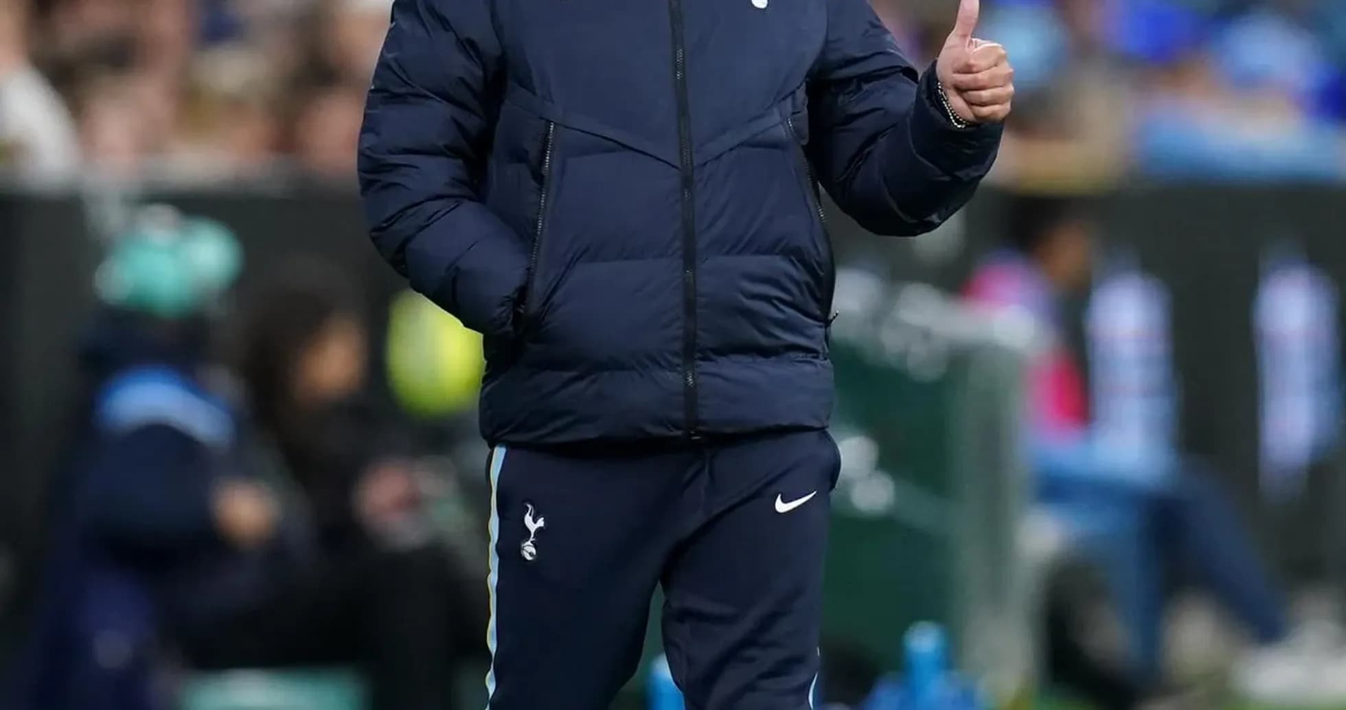Manager giving a thumbs up on the sideline Manager giving a thumbs up on the sideline