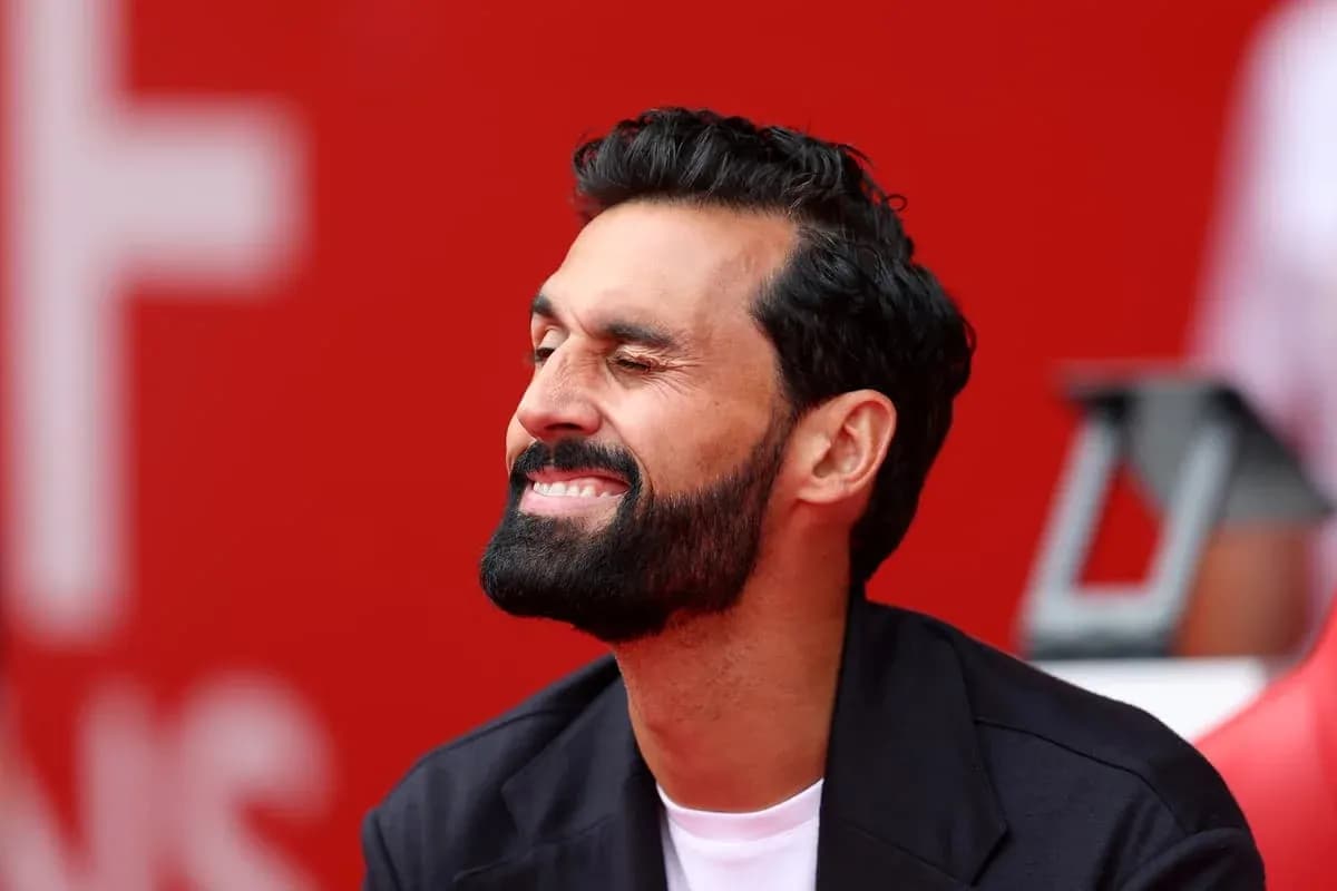 Man smiling with beard, seated on bench Man smiling with beard, seated on bench