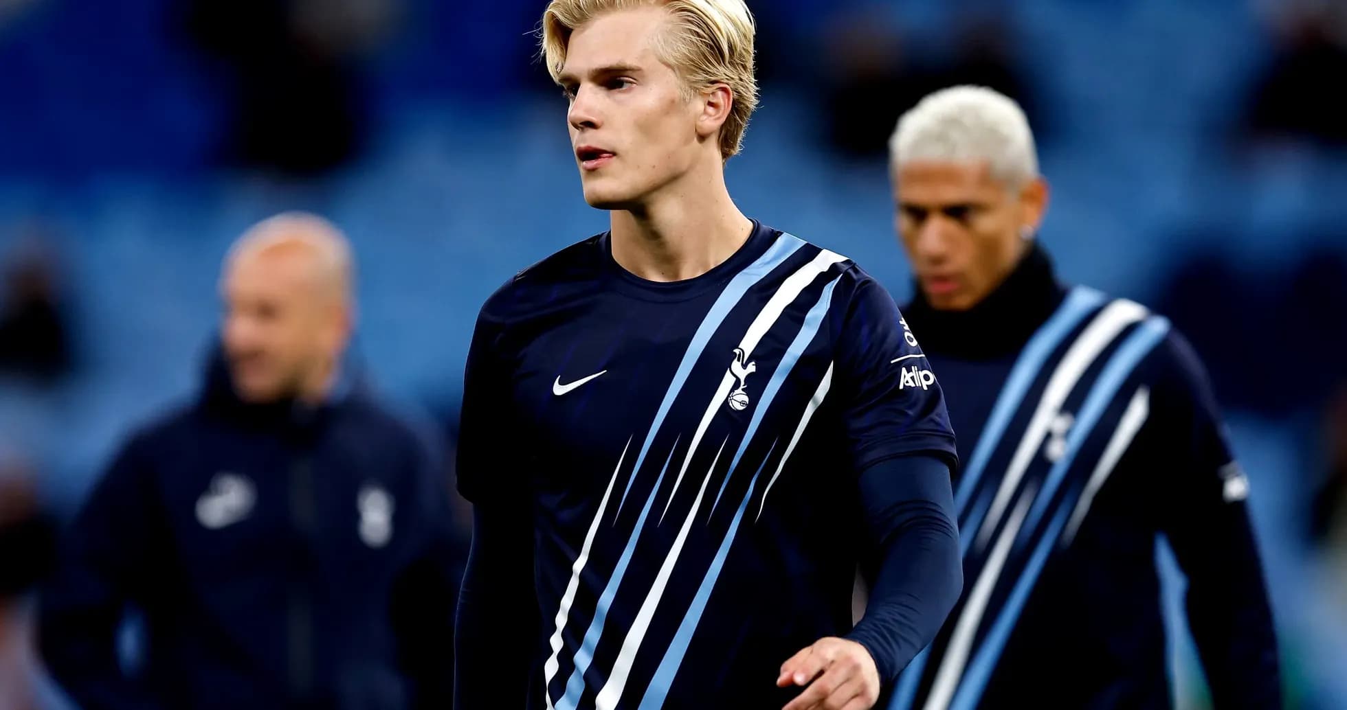 Player in Tottenham training kit on the pitch Player in Tottenham training kit on the pitch