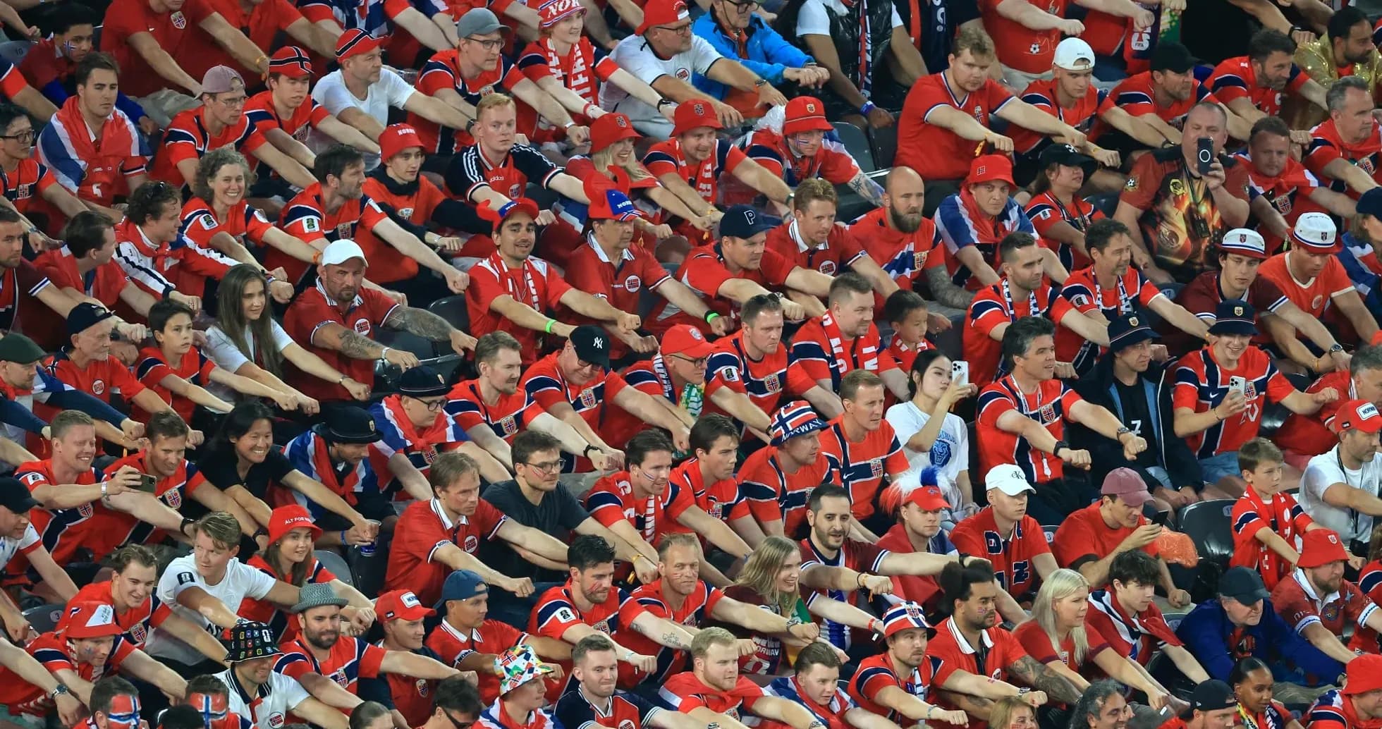 Crowd of fans wearing red jerseys at event Crowd of fans wearing red jerseys at event