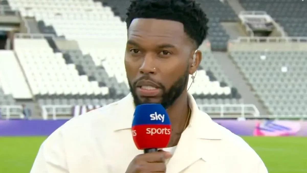 Presenter speaking into microphone on sports field Presenter speaking into microphone on sports field