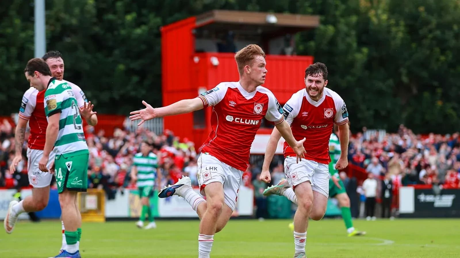 Player celebrating a goal with teammates during match Player celebrating a goal with teammates during match