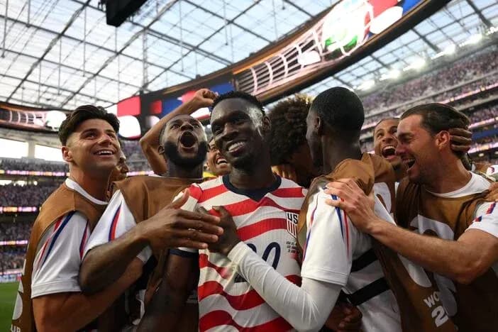 US team celebrating a goal during a match US team celebrating a goal during a match