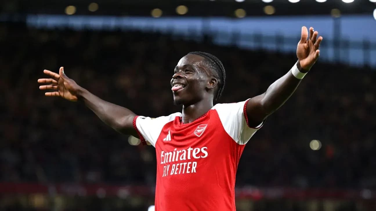 Player celebrating after scoring a goal for Arsenal Player celebrating after scoring a goal for Arsenal