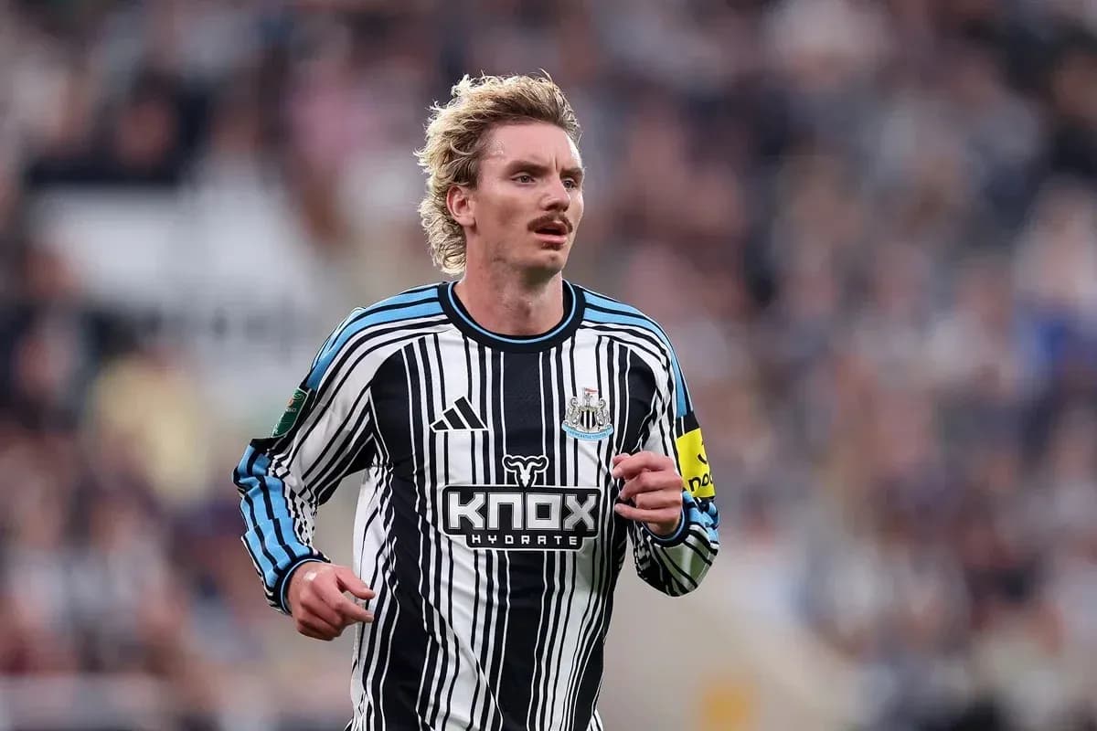 Player running in Newcastle United jersey during match Player running in Newcastle United jersey during match