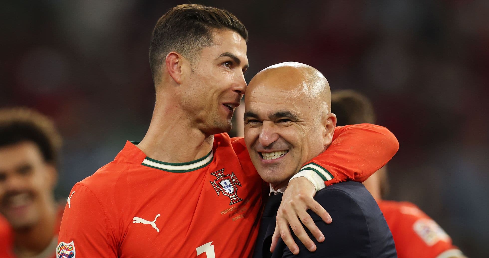Cristiano Ronaldo celebrating with coach Roberto Martinez Cristiano Ronaldo celebrating with coach Roberto Martinez