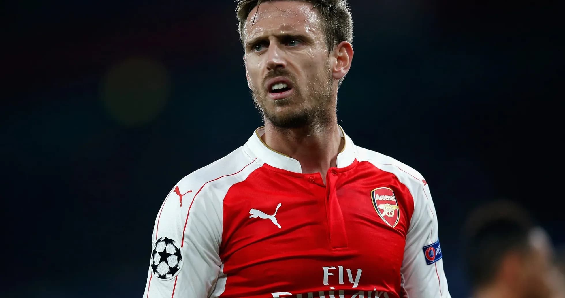 Player wearing Arsenal jersey during a match Player wearing Arsenal jersey during a match