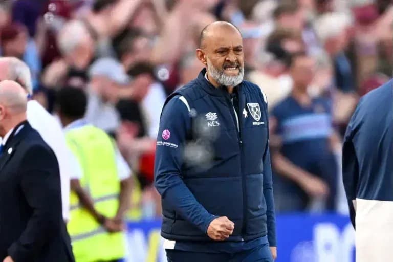Manager celebrating during a match at the stadium Manager celebrating during a match at the stadium