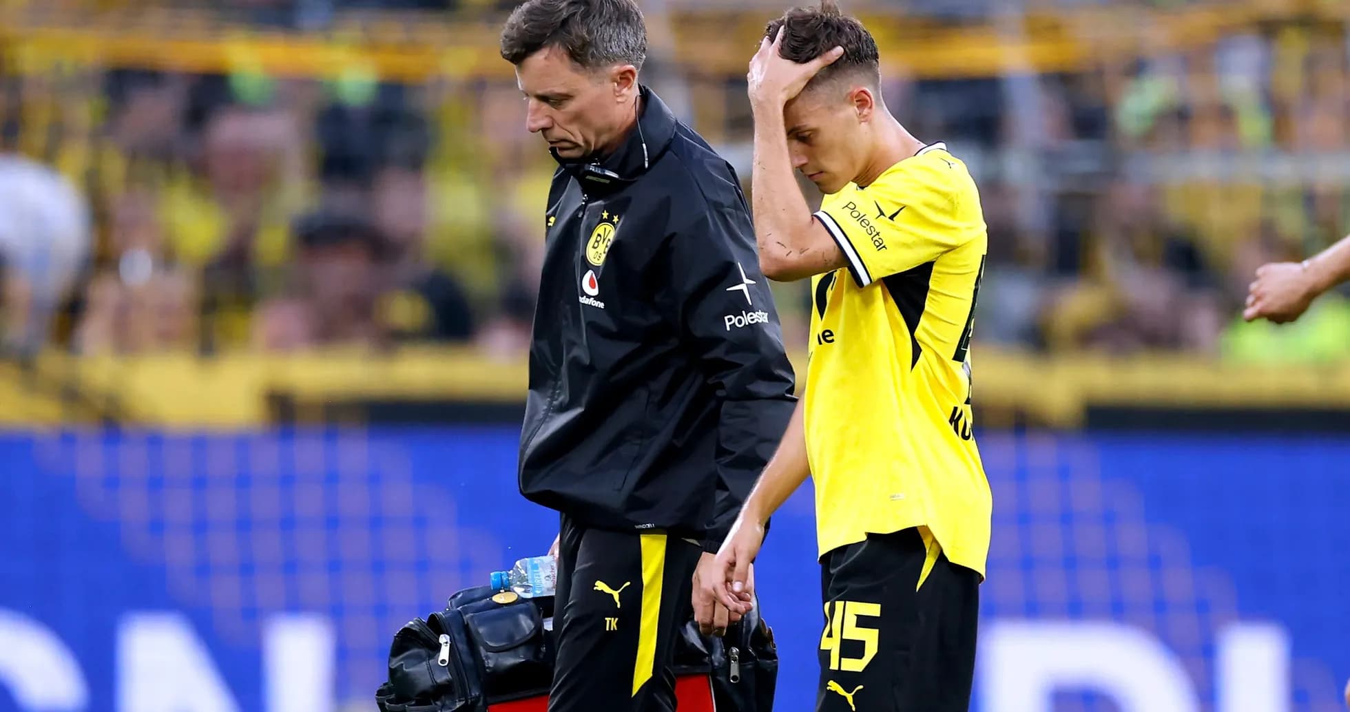 Player receiving medical attention on the field Player receiving medical attention on the field