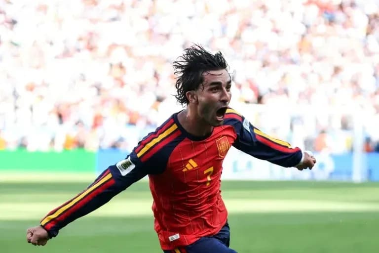 Player celebrating after scoring for Spain Player celebrating after scoring for Spain