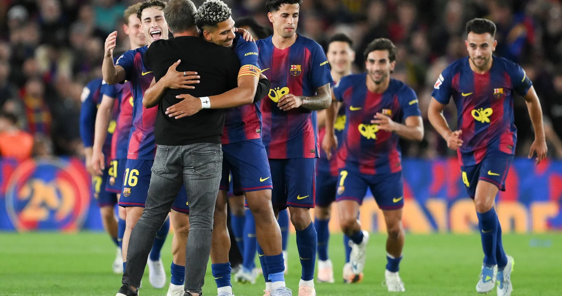 Barcelona players celebrating with coach after victory Barcelona players celebrating with coach after victory