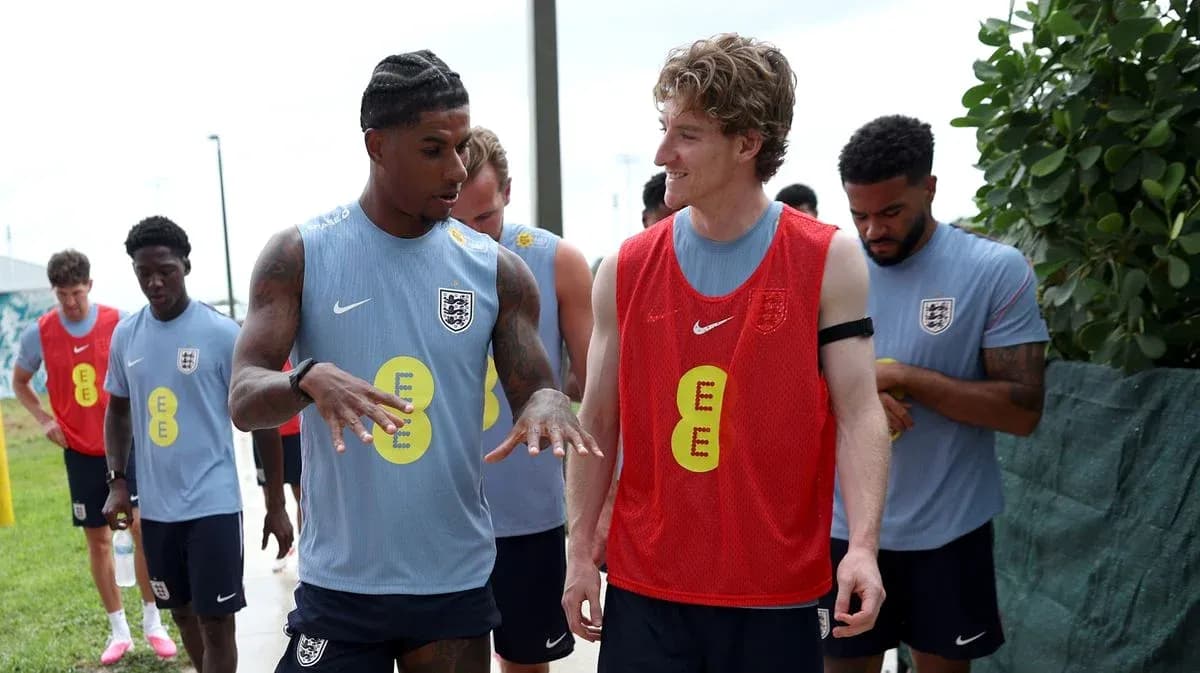 Players interacting during training session in England kits Players interacting during training session in England kits