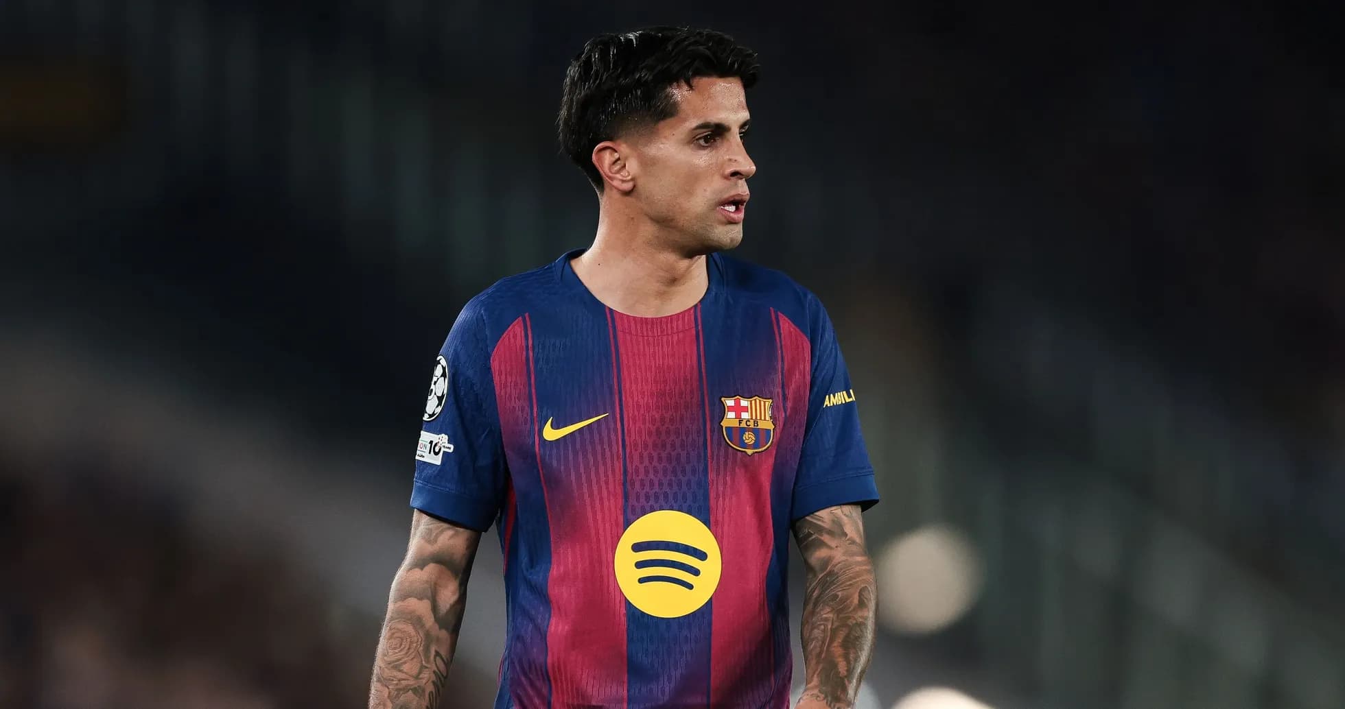 Player wearing Barcelona jersey on the pitch Player wearing Barcelona jersey on the pitch
