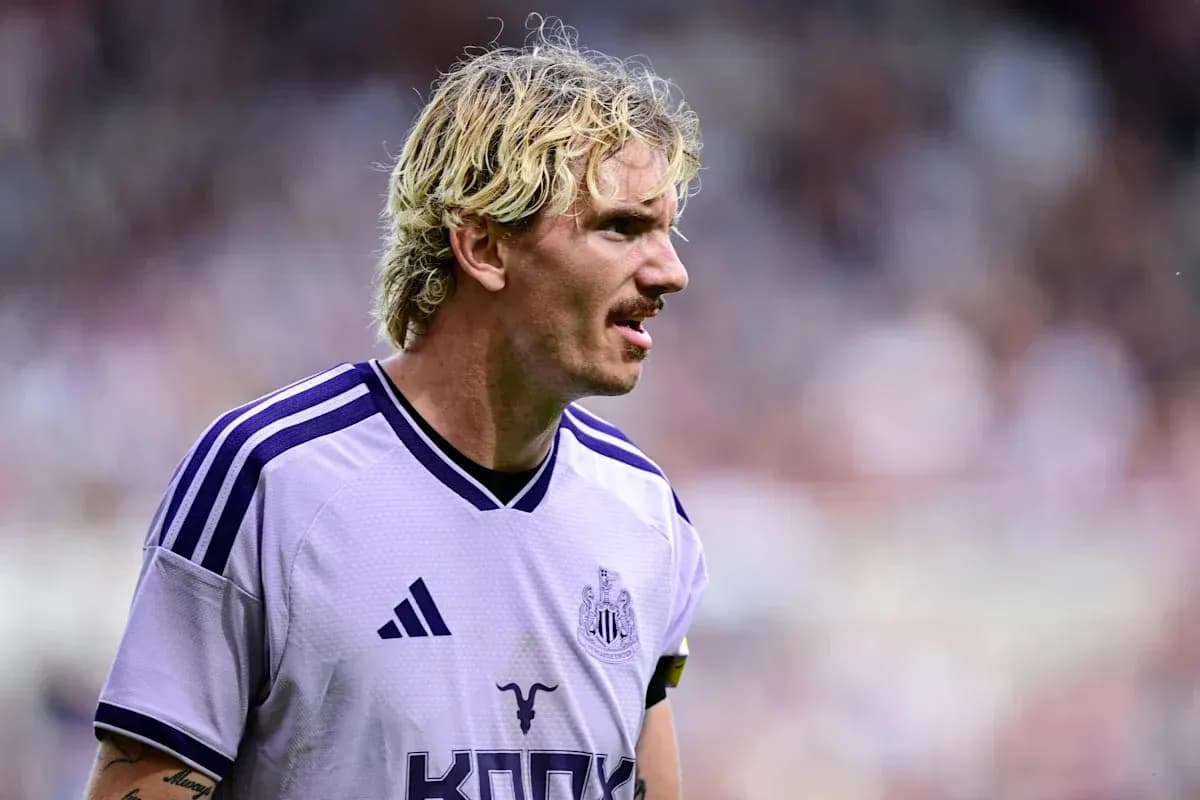 Player in purple Newcastle jersey on the field Player in purple Newcastle jersey on the field
