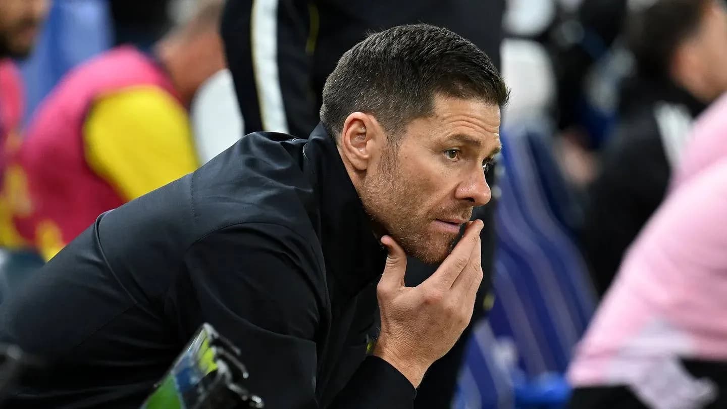 Coach contemplating during match on sidelines Coach contemplating during match on sidelines