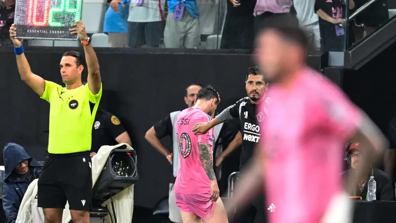 Substitution board raised as player exits match Substitution board raised as player exits match