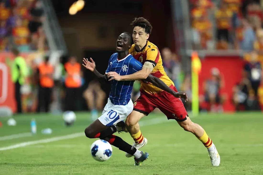Player tackling opponent during Jagiellonia vs Rangers match Player tackling opponent during Jagiellonia vs Rangers match