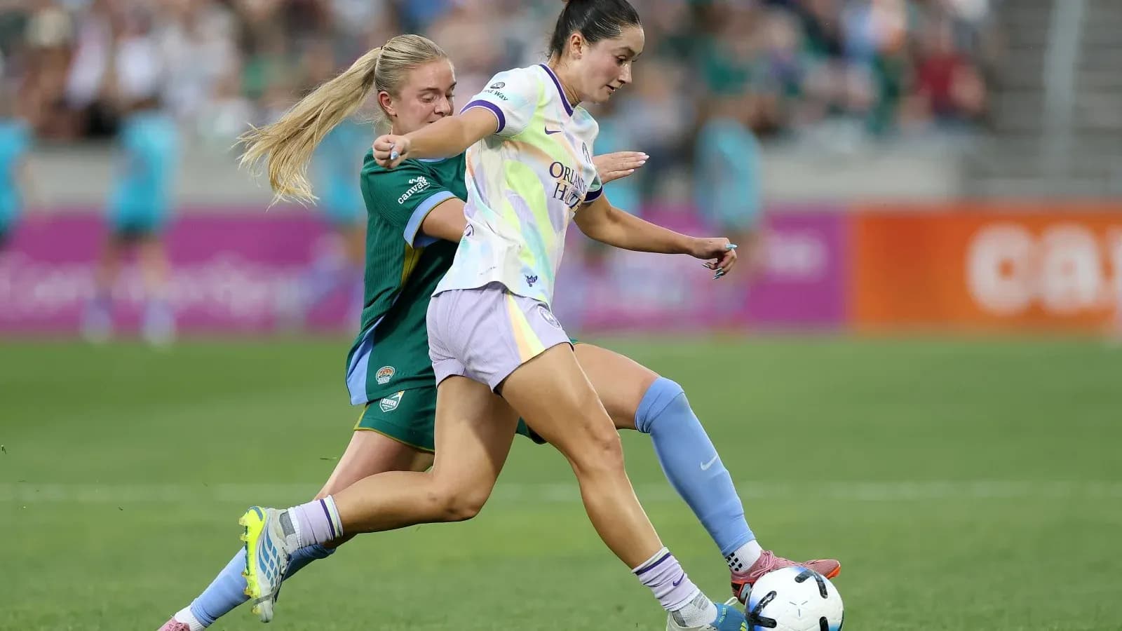 Orlando Pride player dribbling past Bay FC defender Orlando Pride player dribbling past Bay FC defender