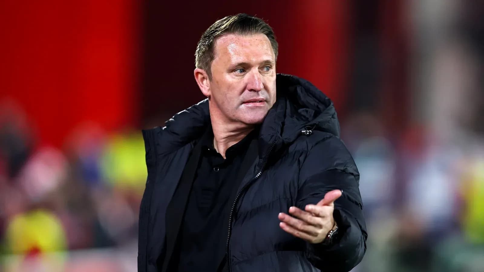 Coach gesturing during a football match on sidelines Coach gesturing during a football match on sidelines