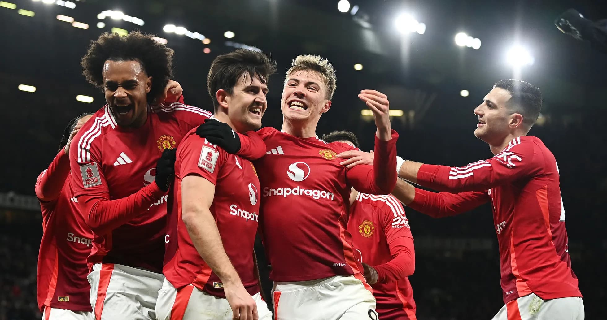Manchester United players celebrating a goal together Manchester United players celebrating a goal together