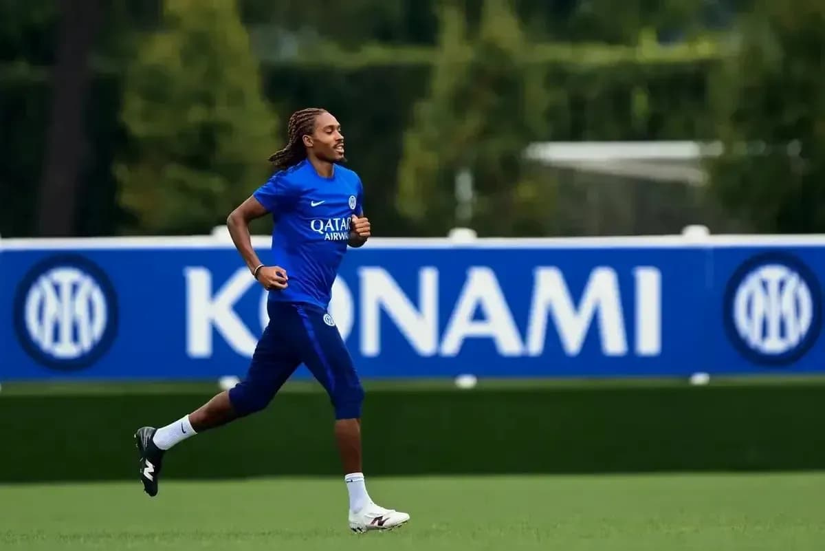 Player running during training session on pitch Player running during training session on pitch