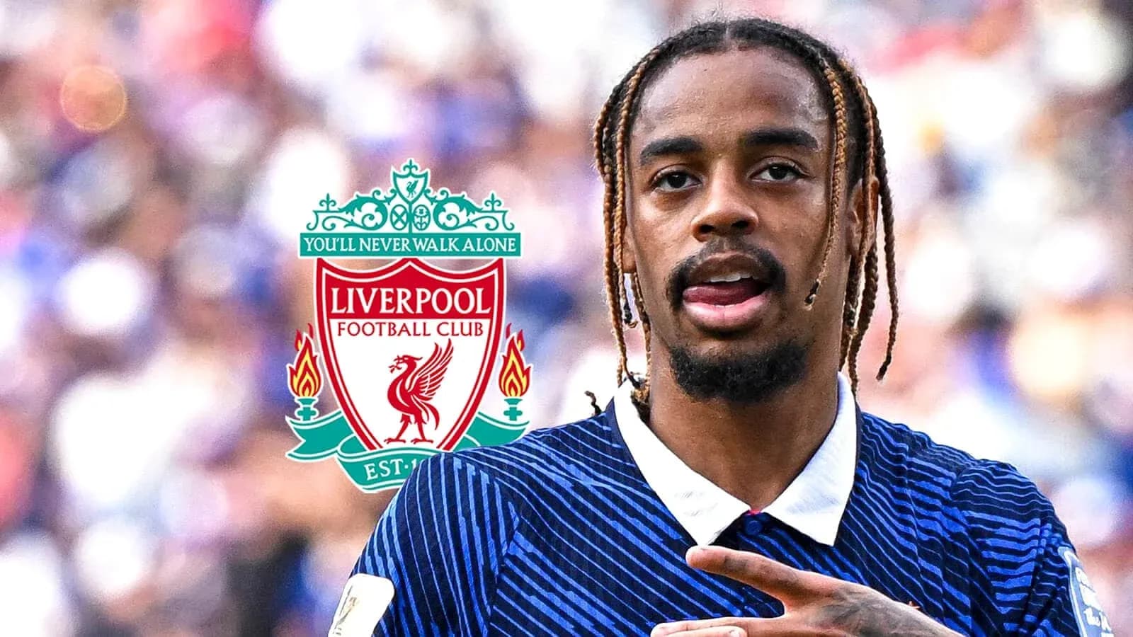 Player celebrating with Liverpool FC logo in background Player celebrating with Liverpool FC logo in background