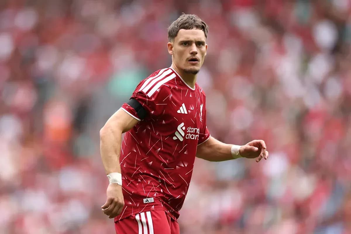 Player in red jersey during football match Player in red jersey during football match