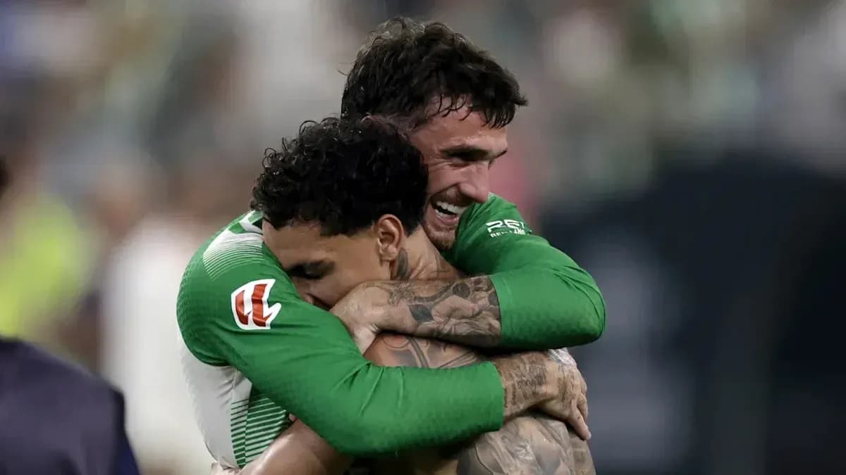Two soccer players embracing after a match Two soccer players embracing after a match