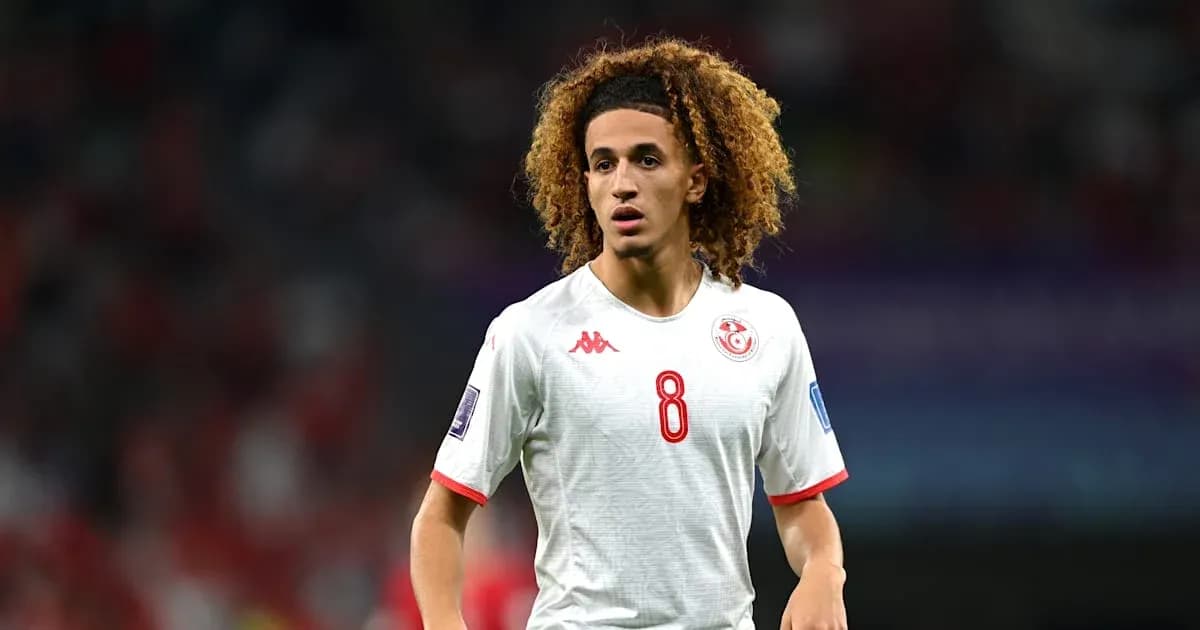 Player wearing Tunisia jersey during match action Player wearing Tunisia jersey during match action