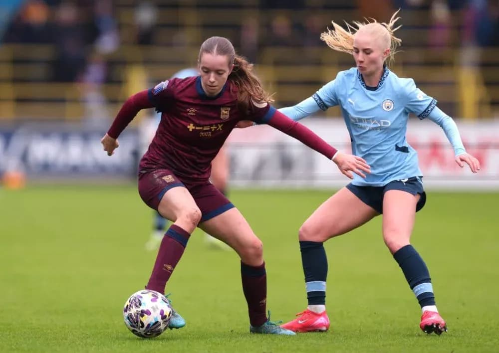 Player dribbling the ball under defensive pressure Player dribbling the ball under defensive pressure