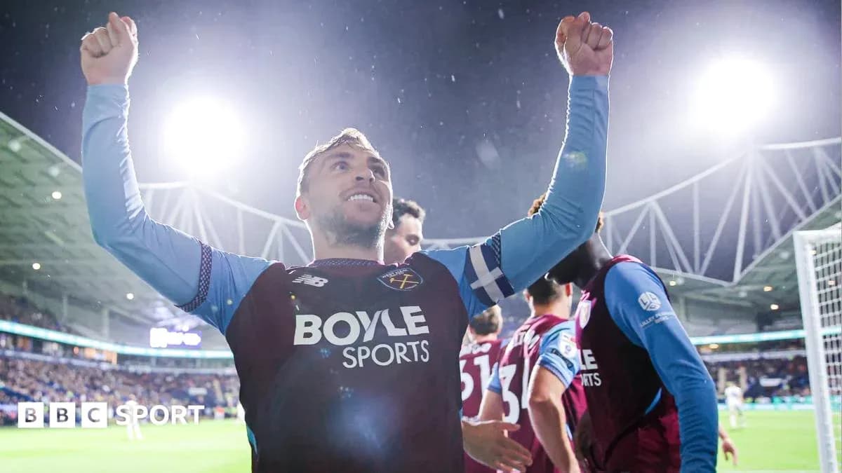 Player celebrating with raised arms during match Player celebrating with raised arms during match