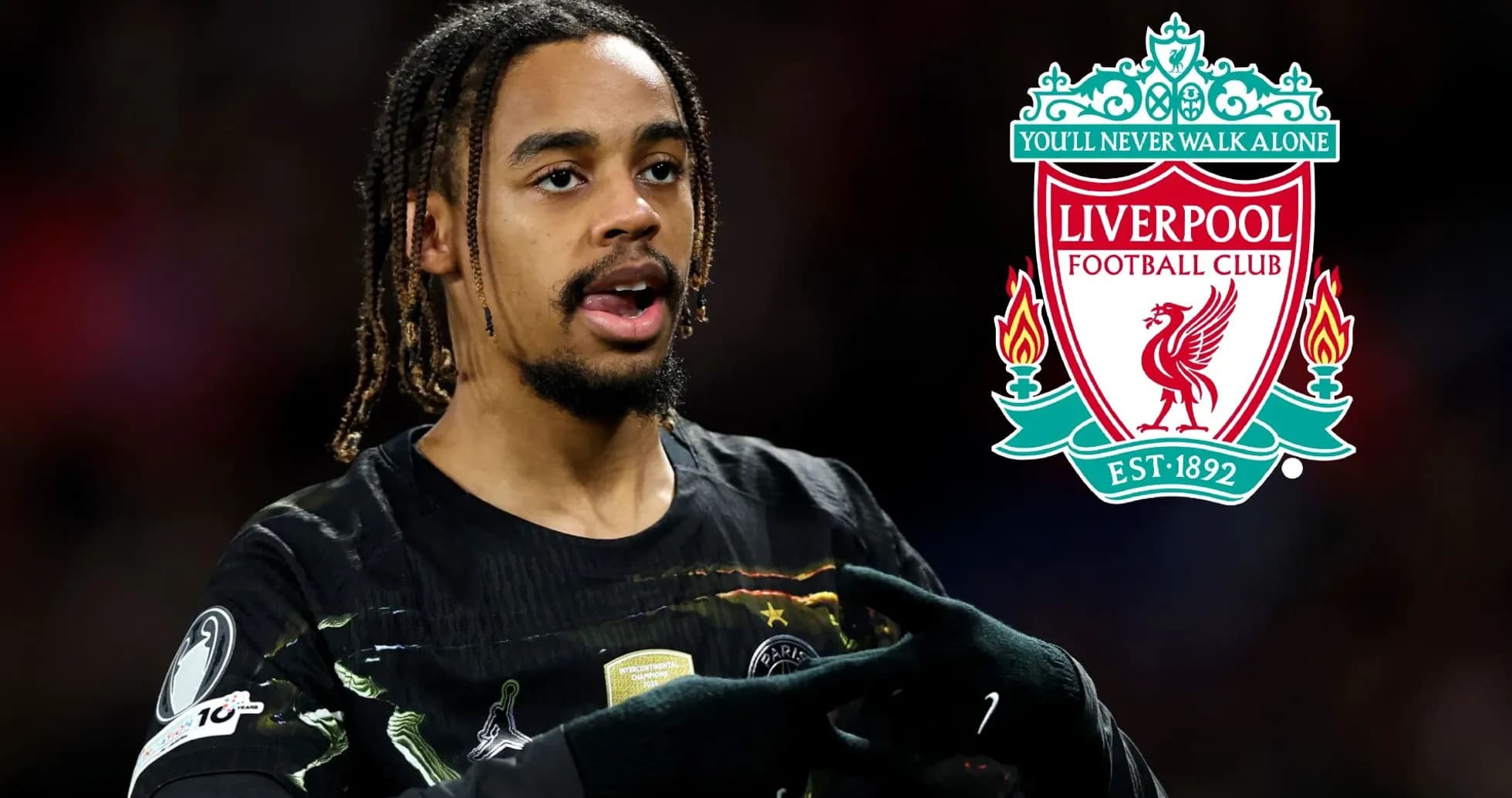 Player gesturing with Liverpool FC logo in background Player gesturing with Liverpool FC logo in background