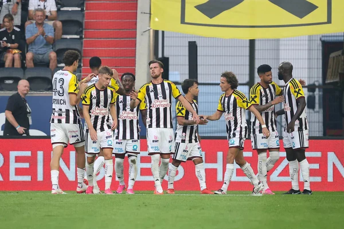 Players celebrating a goal on the field Players celebrating a goal on the field