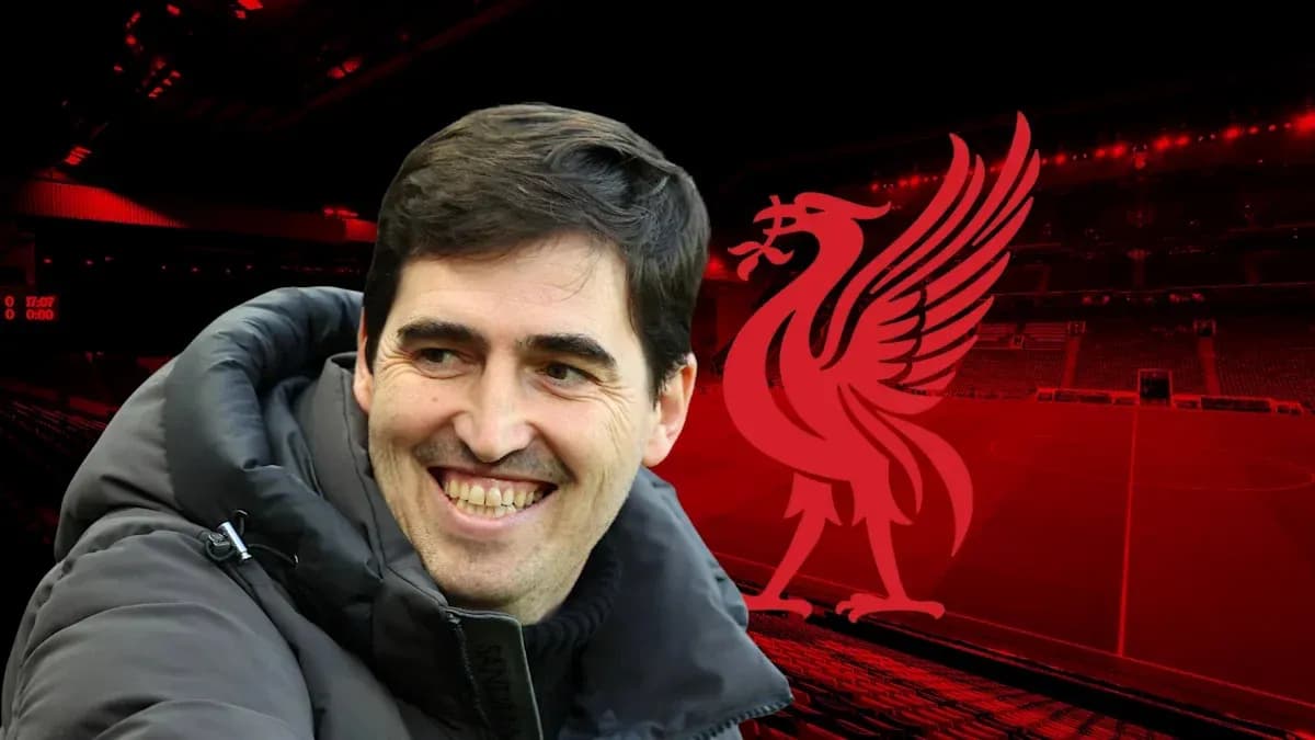Man smiling with Liverpool logo in background Man smiling with Liverpool logo in background