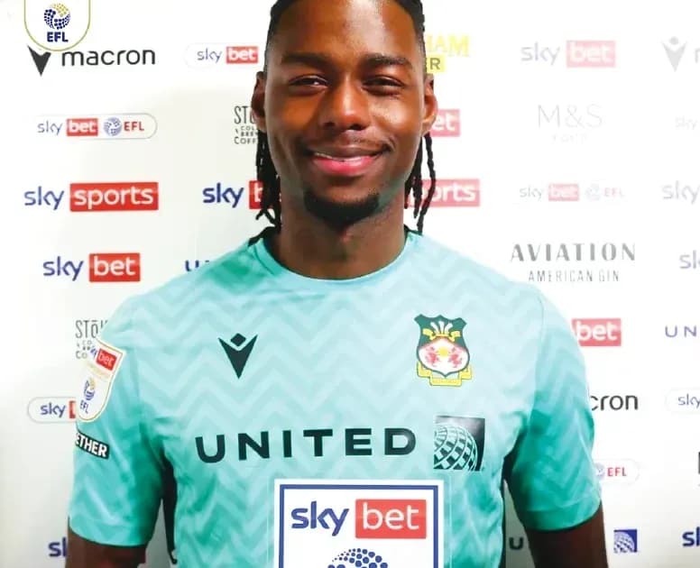 Goalkeeper posing in team kit with sponsor logos Goalkeeper posing in team kit with sponsor logos