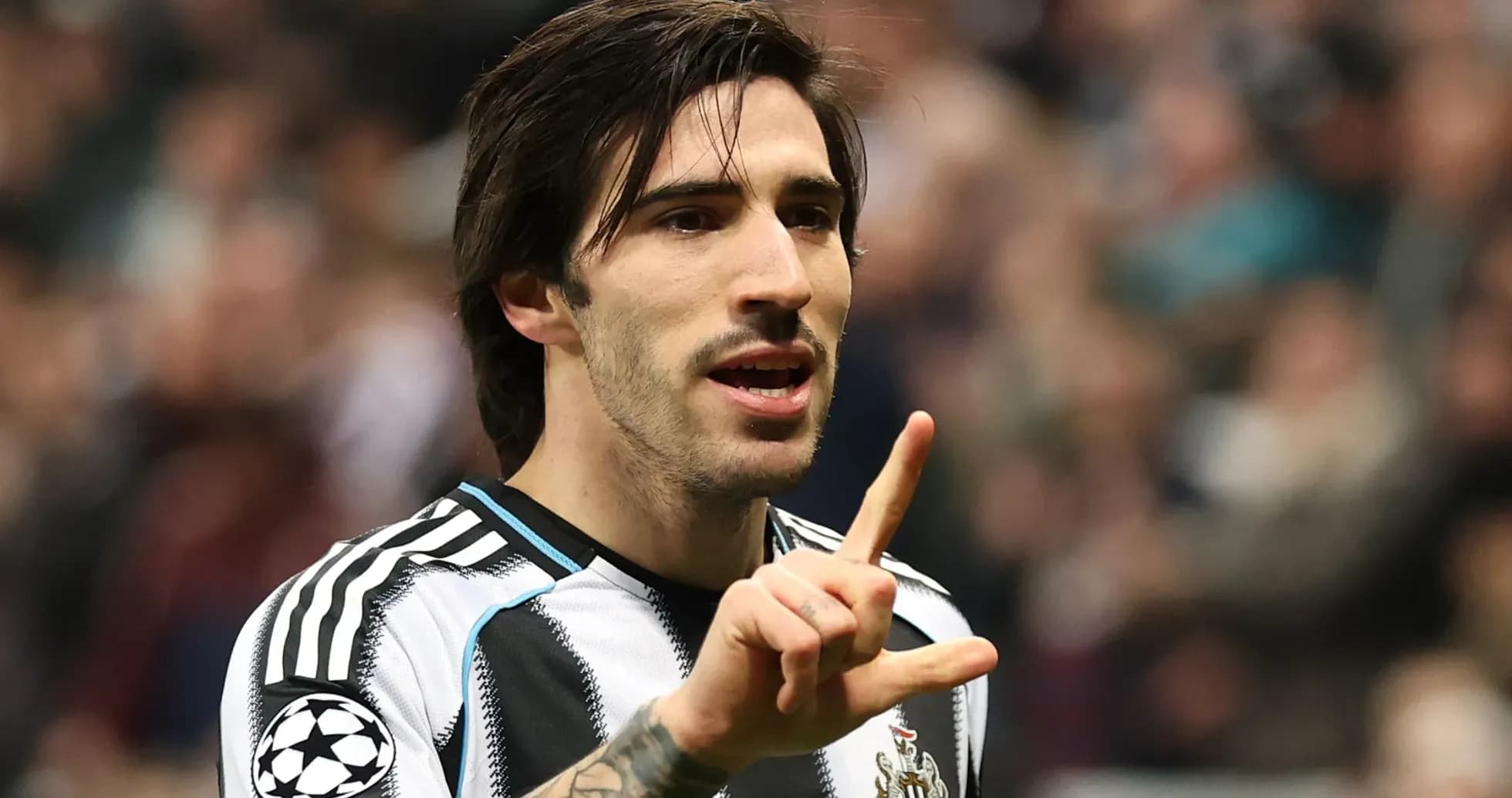 Player gesturing during a football match celebration Player gesturing during a football match celebration